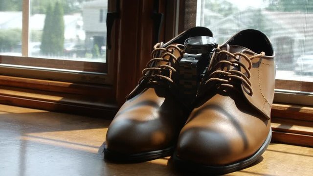 Slow move away from brown shoes on windowsill 