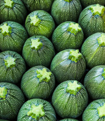 Close up of the ends of zucchini at market. 