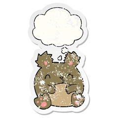 cartoon bear and thought bubble as a distressed worn sticker