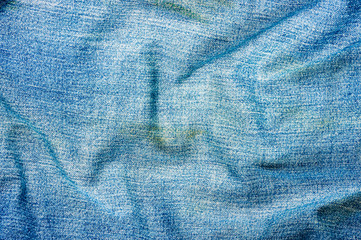 clothing items blue stonewashed faded jeans cotton fabric texture with seams, clasps, buttons and...