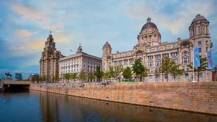 Fototapeta na wymiar Liverpool Pier Head with the Royal Liver Building, Cunard Building and Port of Liverpool Building