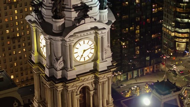 Philadelphia Pennsylvania Aerial v107 Panning birdseye detail of City Hall clock tower low with street view at night - October 2017