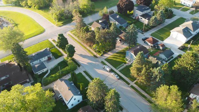 Aerial view of residential houses at summer. American neighborhood, suburb.  Real estate, drone shots, sunrise, sunlight, from above.