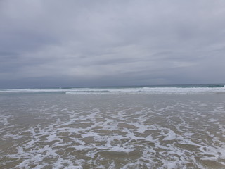 Coolum Beach surf rolling in 