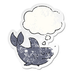 cartoon shark and thought bubble as a distressed worn sticker
