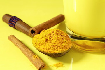 Traditional Indian drink homemade Turmeric golden milk with turmeric powder,cinnamon and holy basil 