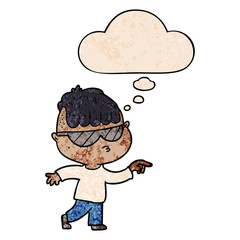 cartoon boy wearing sunglasses pointing and thought bubble in grunge texture pattern style