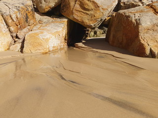 Coolum beach rocky outcrop on the shore