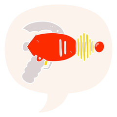 cartoon ray gun and speech bubble in retro style