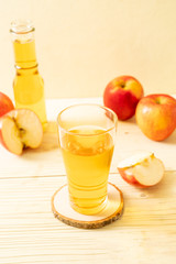 Apple juice with red apples fruits