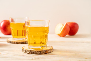 Apple juice with red apples fruits