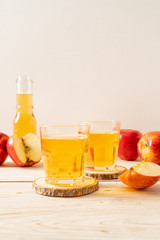 Apple juice with red apples fruits