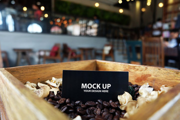 blank black business card on coffee bean