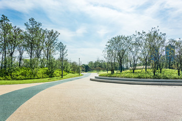 empty square floor and green mountain nature landscape in city park - obrazy, fototapety, plakaty
