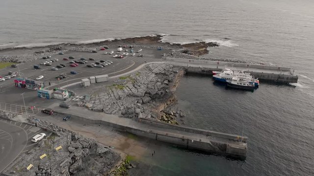 Drone shot showing port of Doolin and the Atlantic Ocean above the port of Doolin by the Wild Atlantic Way in Doolin, Co. Clare, Ireland