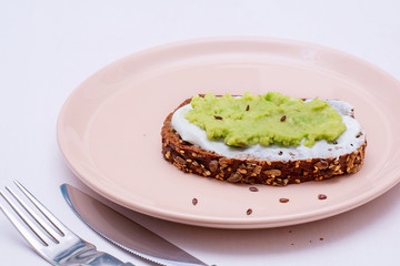 Healthy avocado toast for breakfast or lunch with rye bread and avocado. Vegetarian sandwiches. Herbal diet. Whole food concept.