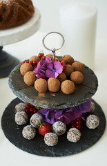 Served homemade chocolate pralines on catering dessert table, close-up