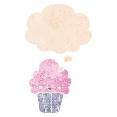 cartoon cupcake with face and thought bubble in retro textured style