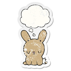 cute cartoon rabbit and thought bubble as a distressed worn sticker