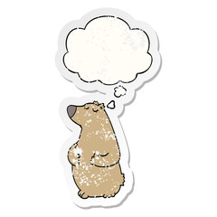 cartoon bear and thought bubble as a distressed worn sticker