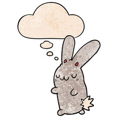 cute cartoon rabbit and thought bubble in grunge texture pattern style