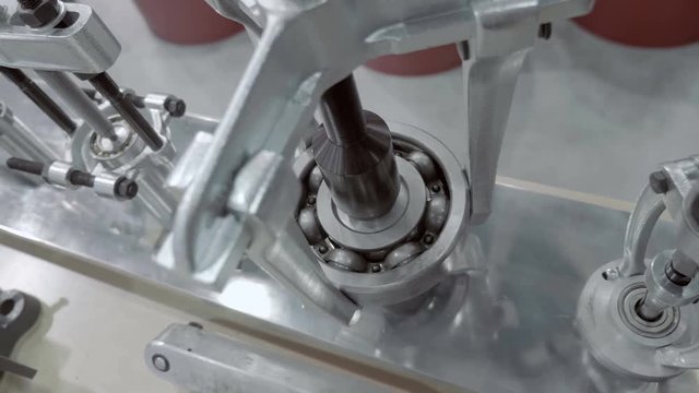A set of new pullers of different size and purpose presented for review at the exhibition in this case, take the axis out of the bearing. Shot in motion