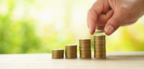 businessman putting money stack on table concept saving finance and accounting