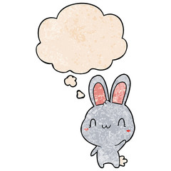 cartoon rabbit waving and thought bubble in grunge texture pattern style