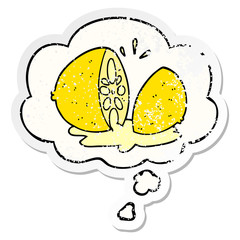cartoon cut lemon and thought bubble as a distressed worn sticker