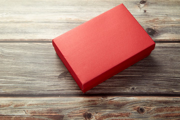 Empty red box on brown wooden