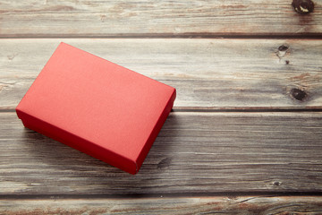 Empty red box on brown wooden