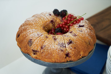 Fresh delicious cake with berries on table, close-up. Summer pie with fruit