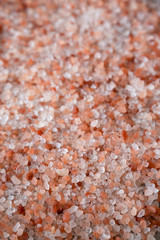Himalayan sea salt background, side view. Selective focus.