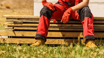 Person wearing red worker trousers