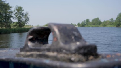 Old black ore mount on a ship. RACK FOCUS, SLOW MOTION - Powered by Adobe