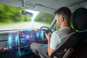 A man in an autonomous car. Self-driving. Concept autopilot, automotive engineering, artificial intelligence