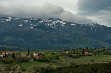 Fototapeta na wymiar Village of Plana - Plana mountain and Vitosha in the distance Bulgaria
