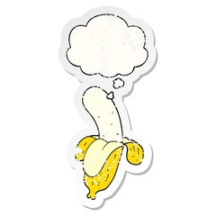 cartoon banana and thought bubble as a distressed worn sticker