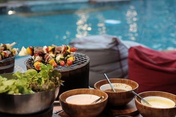 Barbecue party near pool