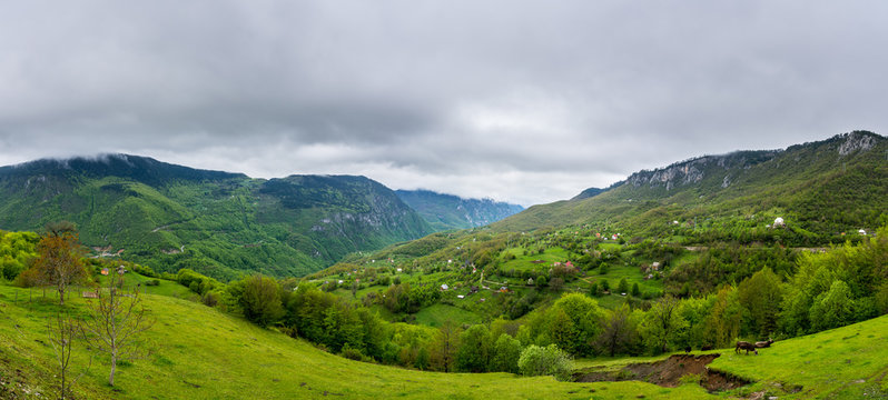 Montenegro, XXL nature landscape panorama of beautiful green tara canyon covered by forest and only few houses © Simon