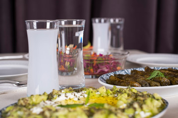 Turkish and Greek Traditional Dinning Table with Special Alcohol Drink Raki. Ouzo and Turkish Raki is a dry anise flavoured aperitif that is widely consumed in Turkey, Greece, Cyprus and Lebanon
