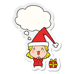 cartoon girl wearing christmas hat and thought bubble as a printed sticker