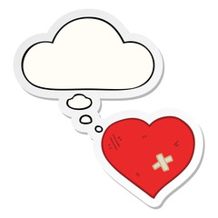 cartoon love heart with sticking plaster and thought bubble as a printed sticker