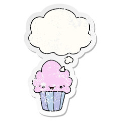 cartoon cupcake with face and thought bubble as a distressed worn sticker