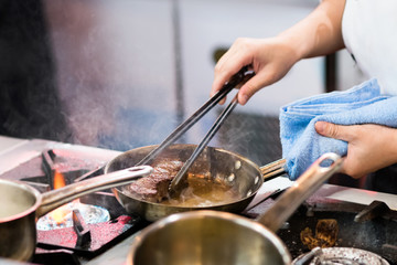 Chef preparing food in the kitchen, chef cooking, Chef decorating dish