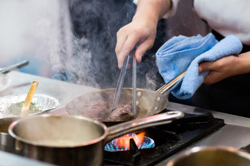 Chef preparing food in the kitchen, chef cooking, Chef decorating dish