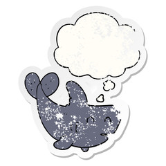 cartoon shark and thought bubble as a distressed worn sticker