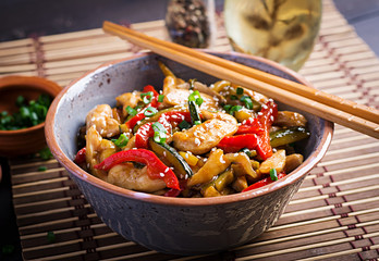 Stir fry chicken, zucchini, sweet peppers and green onion. Asian cuisine