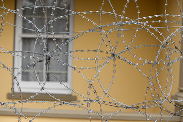 Barbed wire fence at entrance of house