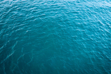 Beach top view with pattern wave. Stock photo image of blue color deep ocean water, sea surface. Soft blue ocean wave, turquoise waves, clear water surface. Nature surface background texture design